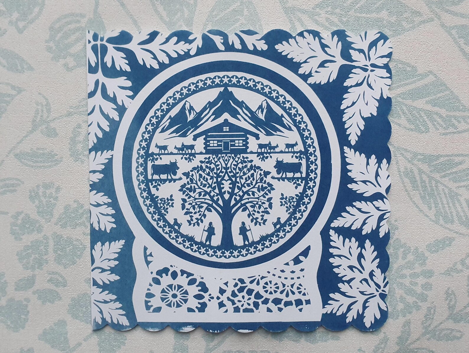 Swiss paper-cut style cyanotype